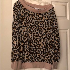 Leopard print off the shoulder sweatshirt.